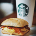 starbucks grande coffee and breakfast sandwich